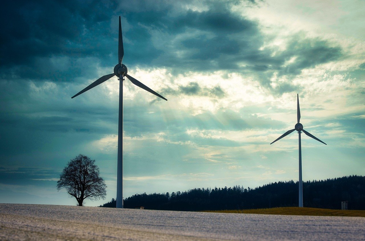 Canadian wind turbines and solar panels with green technology overlay